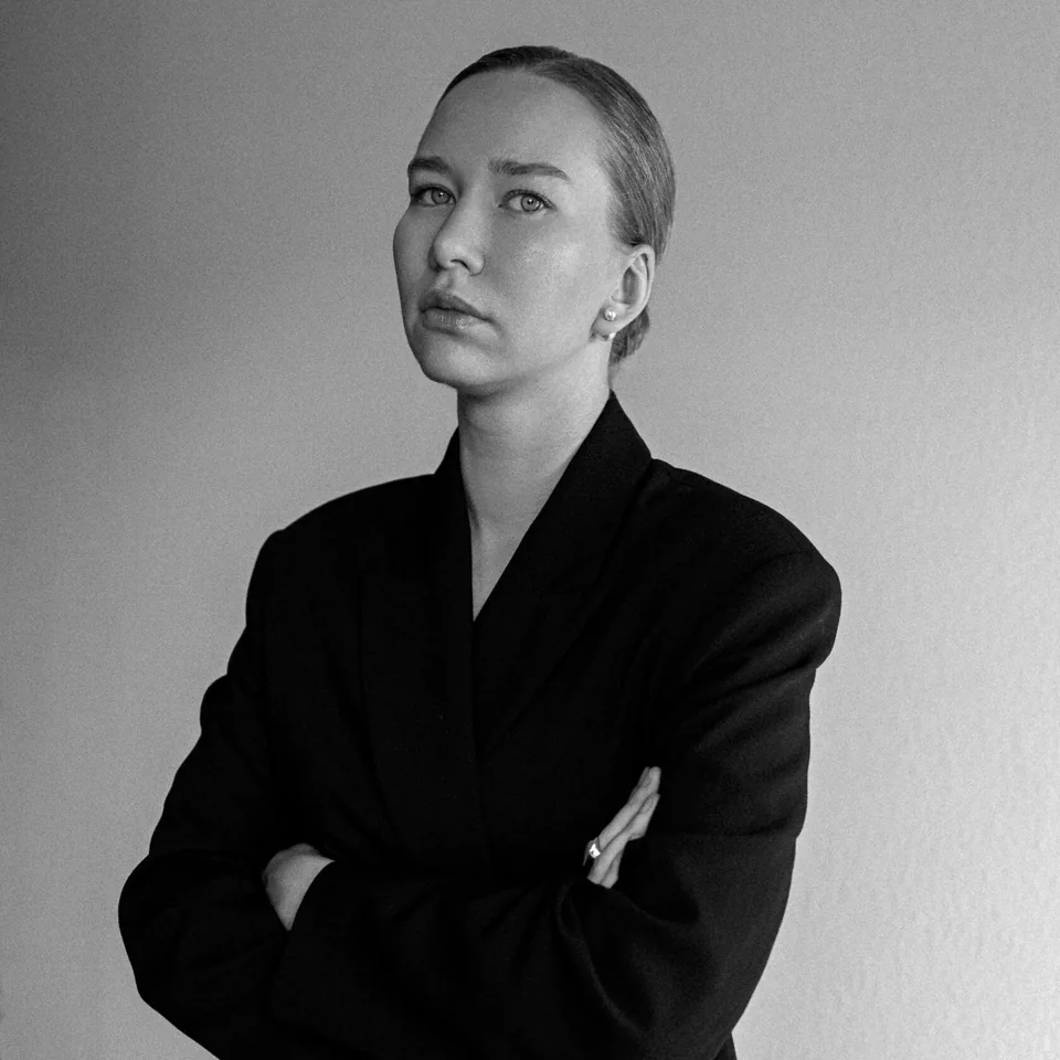 Portrait of photographer Anastasia Ilinskaia in a black blazer